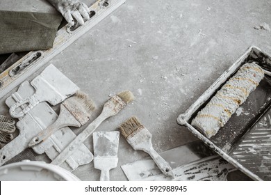 Plastering Tools On Cement Background. View From Top.