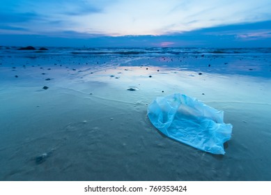 Plastic Bag On The Beach In The Sunrise