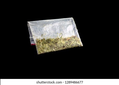 Plastic Bag With A Synthetic Drug Of Kanabioid Origin, Chemical Marijuana, Spice, Isolated On Black