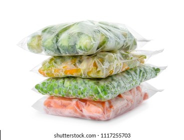 Plastic Bags With Frozen Vegetables On White Background