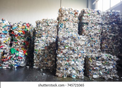 Plastic bales at the waste processing plant. Separate garbage collection. Recycling and storage of waste for further disposal. Business for sorting and processing of waste.