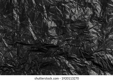 Plastic black crumpled disposable trash bag. Abstract recycled background - Shutterstock ID 1920113270