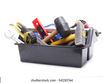 Plastic black toolbox with tools over white background