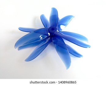Plastic blue racing drone propeller on the white background