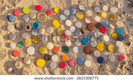 plastic bottle cap on sandy beach pollution, stop motion., single-use concepts