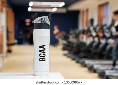 Plastic Bottle Or Cup With Fitness Drink Of Branched-chain Amino Acid Close Up