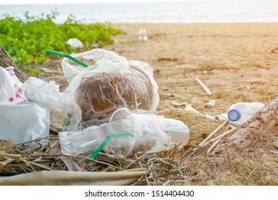 Plastic Bottle Garbage Pollution On The Beach. Big Chemical End Plastics Trash Pollution. Plastic Waste Into The Oceans. Concept For Environmental And Earth Day Campaign.