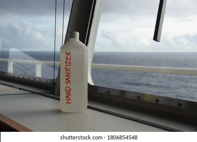 Plastic Bottle With Hand Sterilizer On The Navigational Bridge Near Front Window Of The Merchant Cargo Container Vessel To Protect The Crew And Pilots During Corona Virus And Covid-19. 
