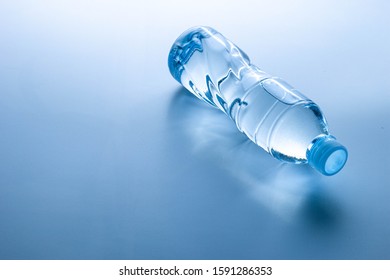 Plastic Bottle Lay Down On White Background.