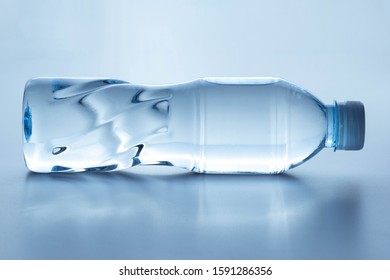 Plastic Bottle Lay Down On White Background.