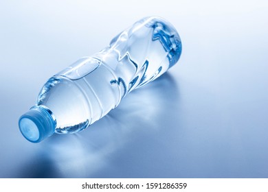 Plastic Bottle Lay Down On White Background.