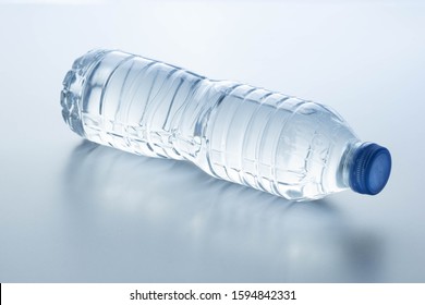 Plastic Bottle Lay Down On White Background.