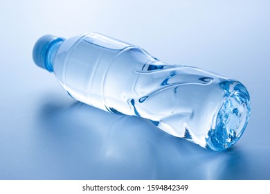 Plastic Bottle Lay Down On White Background.