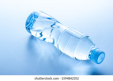 Plastic Bottle Lay Down On White Background.