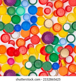 plastic bottle lid seamless background pattern, rainbow color, remove cap before recycling, concept of enviromental polution