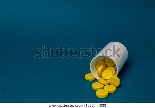 Download Plastic Bottle Yellow Pills Close Stock Photo Edit Now 1352444033 PSD Mockup Templates