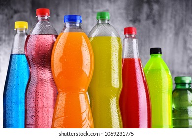 Plastic bottles of assorted carbonated soft drinks in variety of colors
