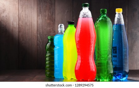 Plastic bottles of assorted carbonated soft drinks in variety of colors