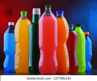Plastic bottles of assorted carbonated soft drinks in variety of colors