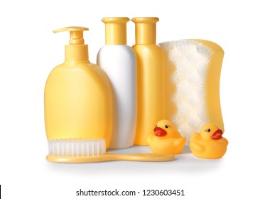 Plastic Bottles Of Baby Cosmetic Products, Shower Sponge And Brush On White Background