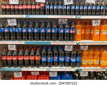 Plastic Bottles Of Carbonated Soft Drinks Kept Together On The Shelf Of A Supermarket At Pune, India On 30 August 2021