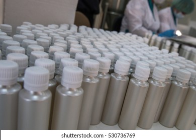 Plastic bottles on the assembly line of cosmetic pharmaceutical company.