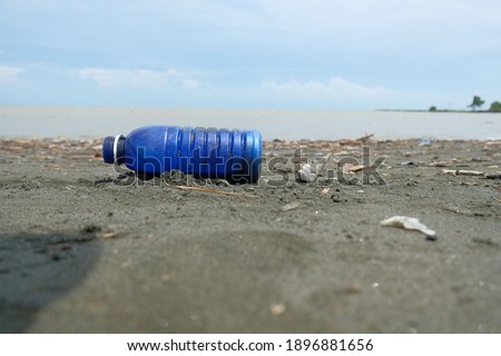 Plastic Bottles - Bottles on the beach, isolated plastic bottles on the beach