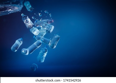 Plastic bottles sinking in to the ocean. Enviromental polution concept. World ocaens day