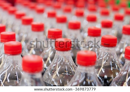 plastic bottles with soft drinks background