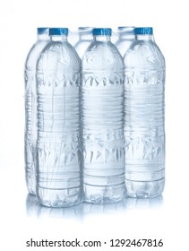 Plastic Bottles Water In Wrapped Package On White Background