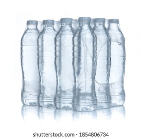 Plastic Bottles Water In Wrapped Package On White Background