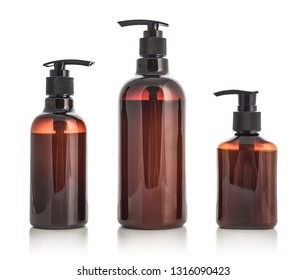 Plastic brown bottles with dispenser pumps isolated on white background. 