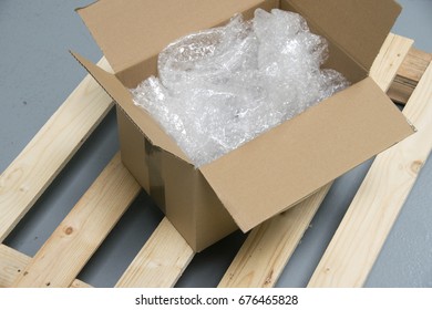 Plastic Bubble Cushioning Wrap In Paper Box On Palette