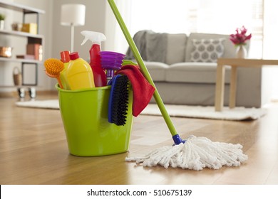 Plastic Bucket With Cleaning Supplies In Home