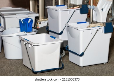 Plastic buckets buckets with wringer, frame, mop as part of a professional cleaning system for small areas for quick and ergonomic cleaning of rooms with high performance.