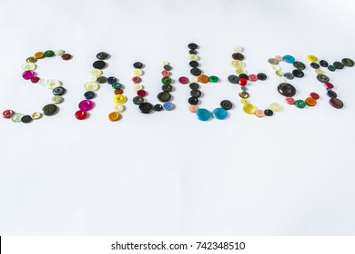 Plastic buttons painted Schutter on a light background. Many multi-colored buttons