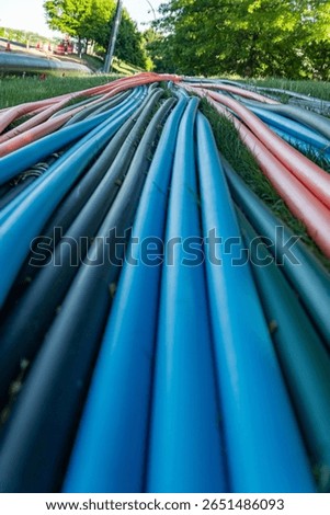 Plastic cable ducts for communication lines. Close-up. Outdoor broadband deployment.