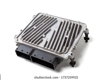 A plastic car engine control unit with metal elements on a white isolated background is the connecting center of various subsystems, units and assemblies. Spare part for repair in a auto service.