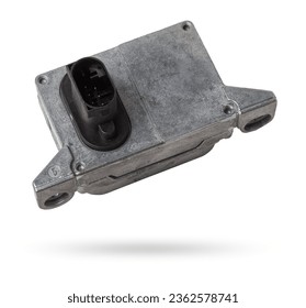 Plastic car engine control unit with metal elements on a white isolated background is the connecting center of various subsystems, units and assemblies. Monitoring the state of the moment. Spare part