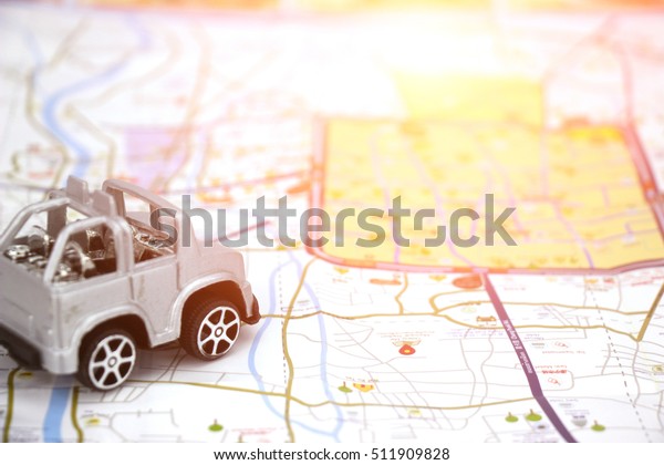 plastic car
toy background map  to travel
concept.