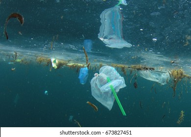 Plastic carrier bags and straws pollution in ocean
