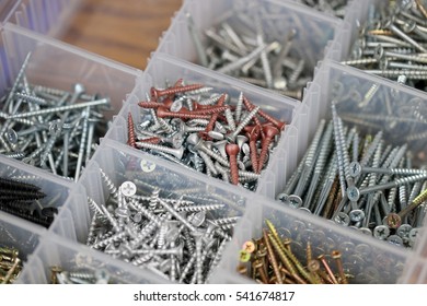 Plastic case with different screws.