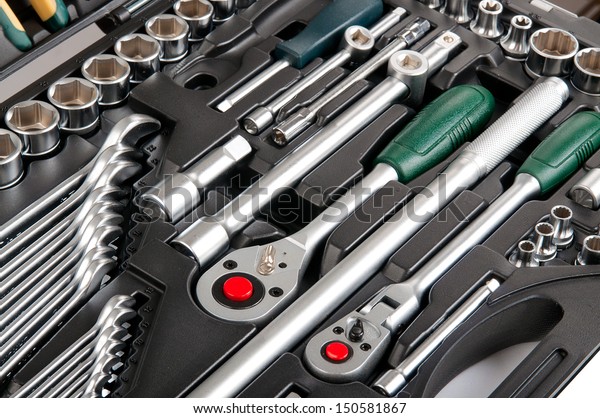 Plastic case with different tools. Isolated on\
white background