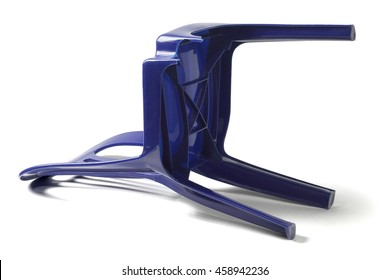 Plastic Chair with Broken Leg Lying on White Background