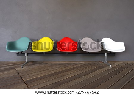 Plastic chairs isolated on gray background and wooden floor