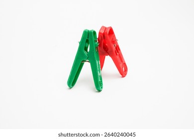 Plastic Clips Standing in Balance on White Background