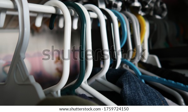 Plastic Clothing Hangers in\
Closet