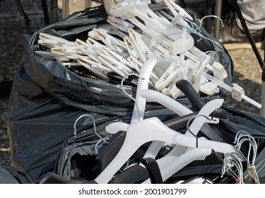 Plastic Coat Hangers Pile Inside Bag On Outside Market