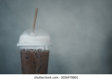 Plastic Coffee Glass Iced Mocha Coffee Topping With Milk Foam. Close Up