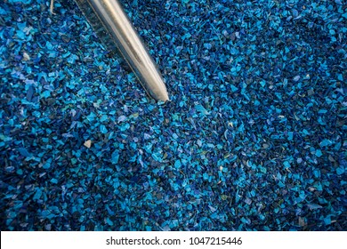 Plastic Colored Granulated Crumb At The Plant For Processing And Casting Products From Domestic And Industrial Waste. Ready For Loading In The Machine For Remelting And Manufacturing Parts